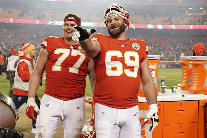 Jan 16, 2022; Kansas City, Missouri, USA; Kansas City Chiefs guard Andrew Wylie (77) and guard Kyle Long (69) leave the field after the win over the Pittsburgh Steelers in an AFC Wild Card playoff football game at GEHA Field at Arrowhead Stadium. Mandatory Credit: Denny Medley-USA TODAY Sports